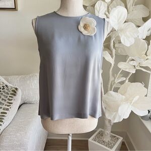 CHANEL Sleeveless Silk Top with White Floral Detail